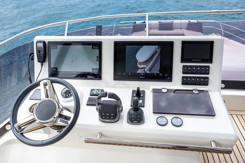  Yacht Photos Pics 2024 Prestige M48 yacht helm with advanced navigation screens and controls, overlooking the ocean.