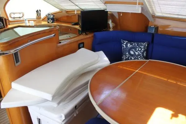 Jobsite Yacht Photos Pics Interior of 2006 Alliaura Marine Privilege 435 EZC yacht with dining area and cushions.