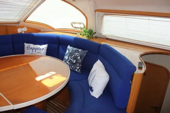 Jobsite Yacht Photos Pics 2006 Alliaura Marine Privilege 435 EZC interior with blue seating and decorative pillows.