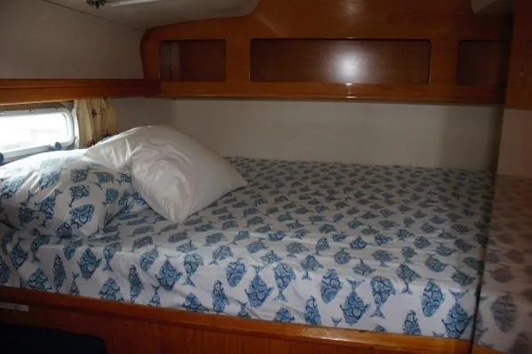 Jobsite Yacht Photos Pics Cabin interior of 2006 Alliaura Marine Privilege 435 EZC with patterned bedding.