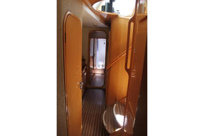 Jobsite Yacht Photos Pics Interior hallway of 2006 Alliaura Marine Privilege 435 EZC yacht, featuring wooden finishes.