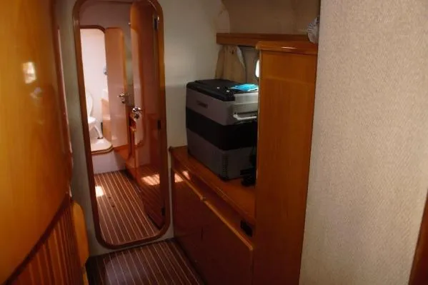 Jobsite Yacht Photos Pics Interior of 2006 Alliaura Marine Privilege 435 EZC yacht, featuring wood paneling and compact appliances.