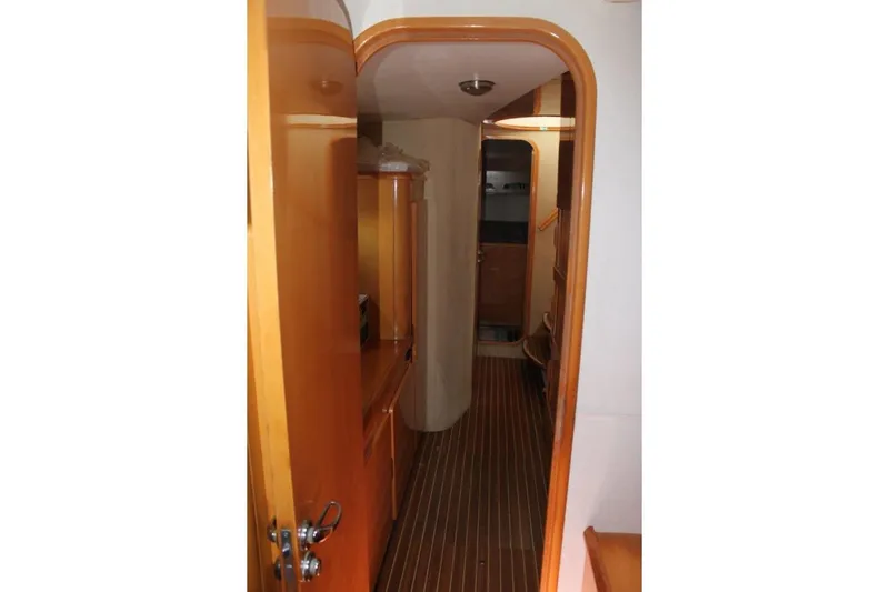 Jobsite Yacht Photos Pics Interior hallway of 2006 Alliaura Marine Privilege 435 EZC yacht, featuring wooden finishes.