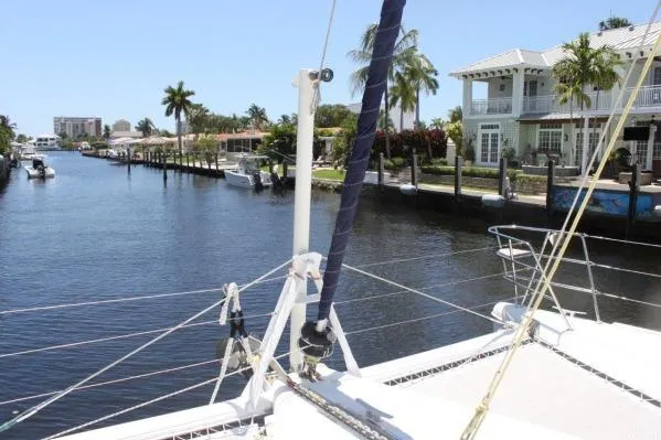 Jobsite Yacht Photos Pics 2006 Alliaura Marine Privilege 435 EZC catamaran docked in a scenic canal setting.
