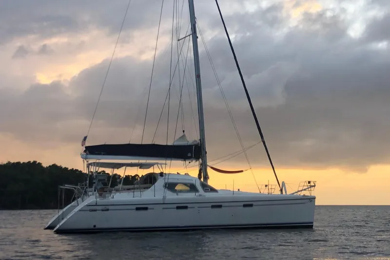 Jobsite Yacht Photos Pics 2006 Alliaura Privilege 435 EZC catamaran at sunset on calm waters.