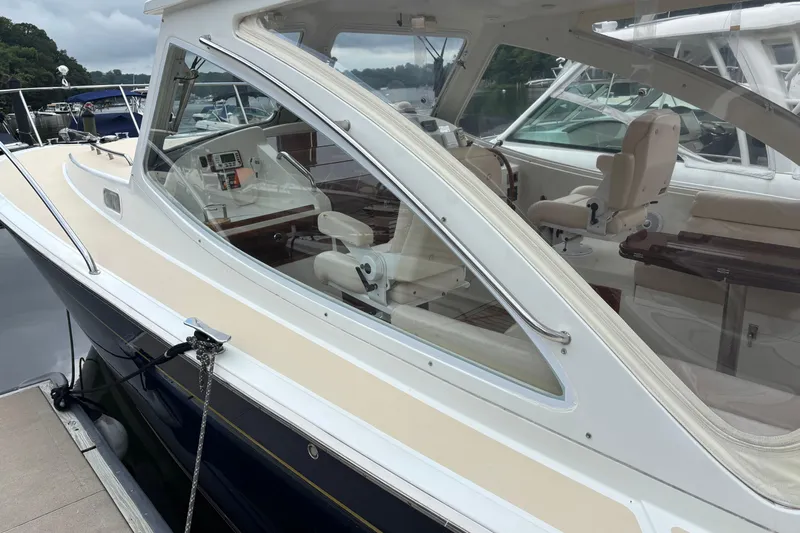 Zest Yacht Photos Pics 2006 MJM 34z Express HT yacht docked, showcasing sleek design and luxurious interior.