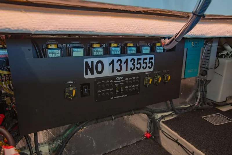  Yacht Photos Pics Electrical panel of 2021 Regal 36 Grande Coupe boat, showing circuit breakers and wiring.