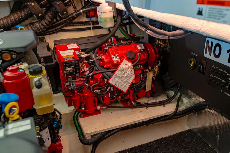  Yacht Photos Pics Engine room of 2021 Regal 36 Grande Coupe with red machinery and wiring.
