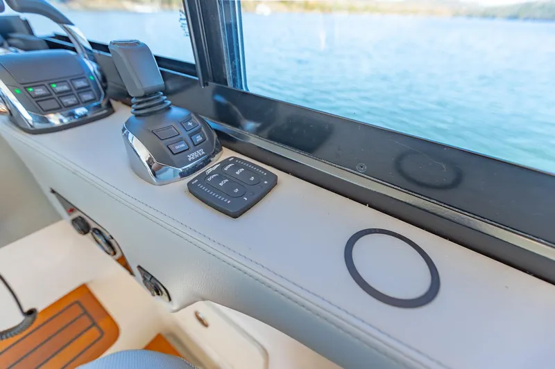  Yacht Photos Pics Control panel of 2021 Regal 36 Grande Coupe overlooking water.