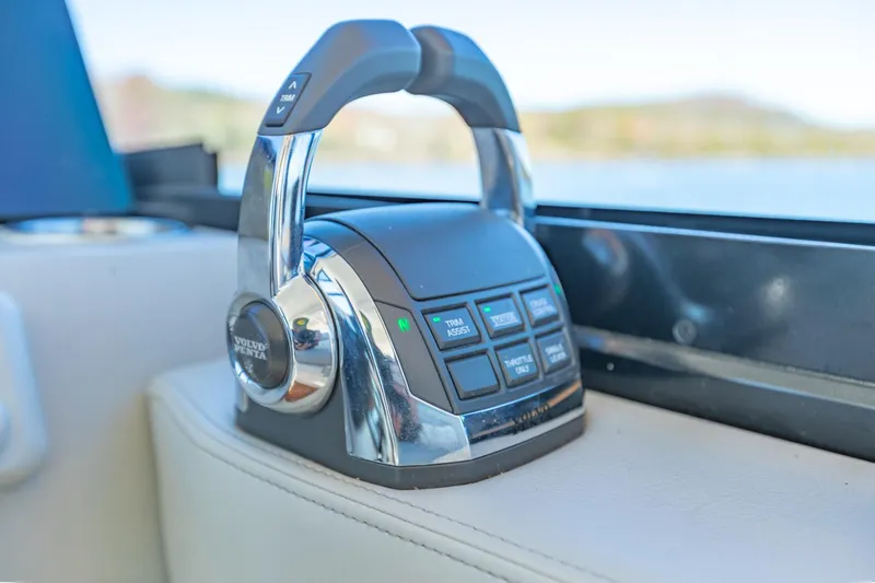  Yacht Photos Pics Throttle control of 2021 Regal 36 Grande Coupe boat, featuring sleek design and modern technology.