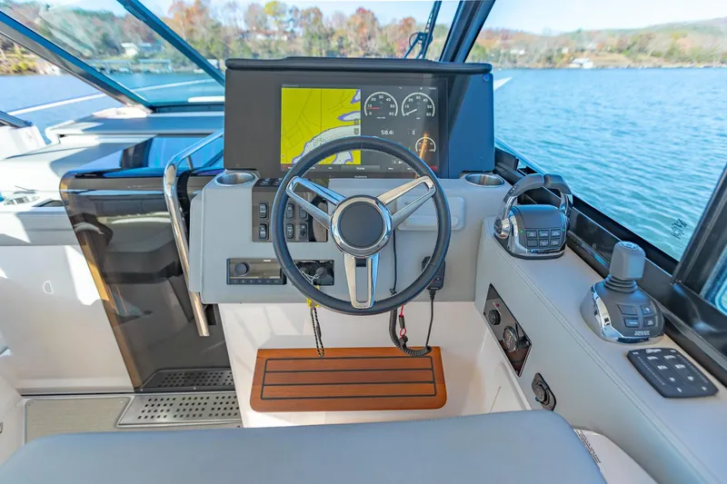 Yacht Photos Pics 2021 Regal 36 Grande Coupe helm with modern controls and navigation display.