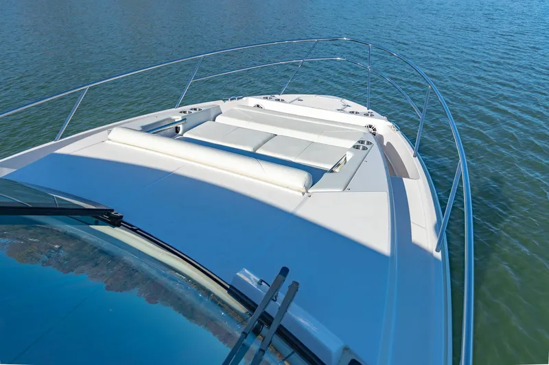  Yacht Photos Pics 2021 Regal 36 Grande Coupe yacht on calm water, showcasing sleek deck design.