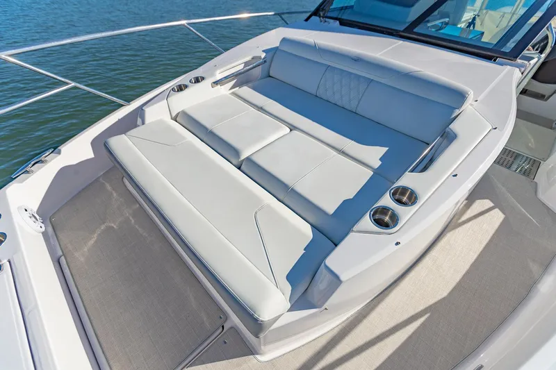  Yacht Photos Pics Luxurious seating on 2021 Regal 36 Grande Coupe yacht, featuring sleek design and comfortable cushions.