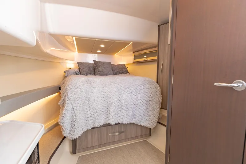 Yacht Photos Pics Luxurious bedroom interior of 2021 Regal 36 Grande Coupe yacht.