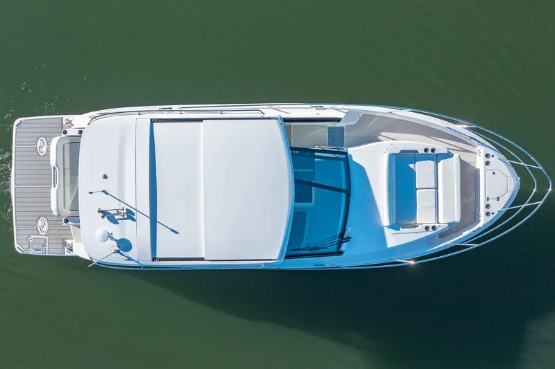  Yacht Photos Pics Aerial view of 2021 Regal 36 Grande Coupe yacht on calm water.