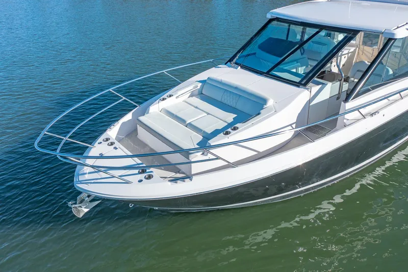  Yacht Photos Pics 2021 Regal 36 Grande Coupe boat on calm water, featuring sleek design and spacious deck.