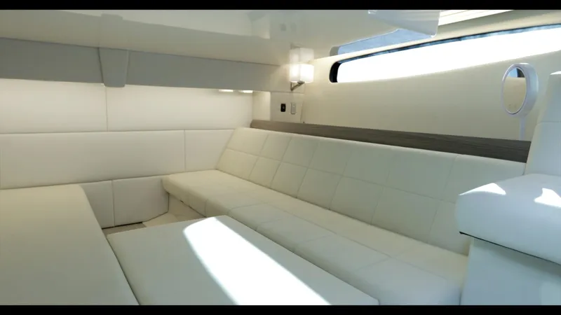  Yacht Photos Pics Luxurious interior of 2021 Regal 36 Grande Coupe yacht with white seating.