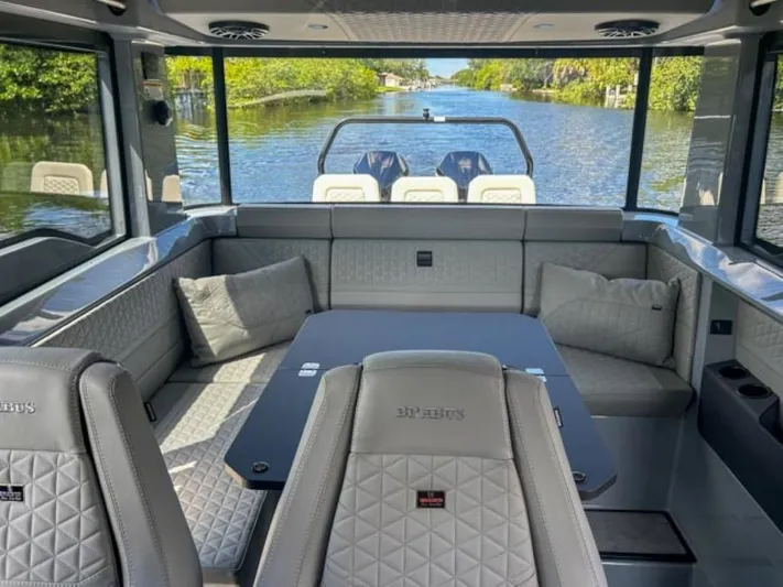  Yacht Photos Pics Luxurious interior of 2024 BRABUS Shadow 1000XC boat with quilted seating and scenic water view.
