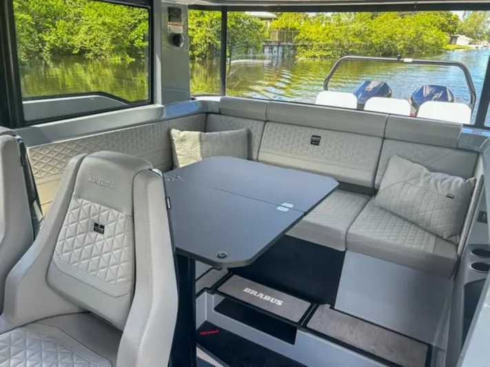  Yacht Photos Pics Luxurious interior of 2024 BRABUS Shadow 1000XC boat with quilted seating and sleek design.