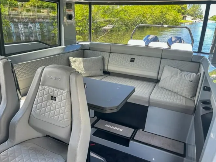  Yacht Photos Pics Luxurious interior of 2024 BRABUS Shadow 1000XC boat with quilted seating and sleek design.