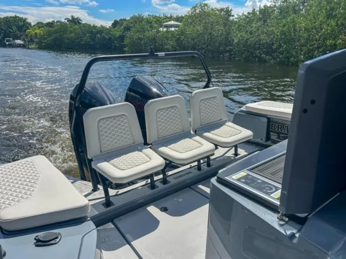  Yacht Photos Pics 2024 BRABUS Shadow 1000XC boat interior with white seating and dual engines on a sunny day.