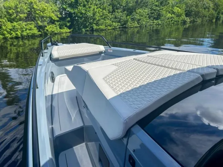  Yacht Photos Pics 2024 BRABUS Shadow 1000XC luxury boat with quilted seating on calm water.