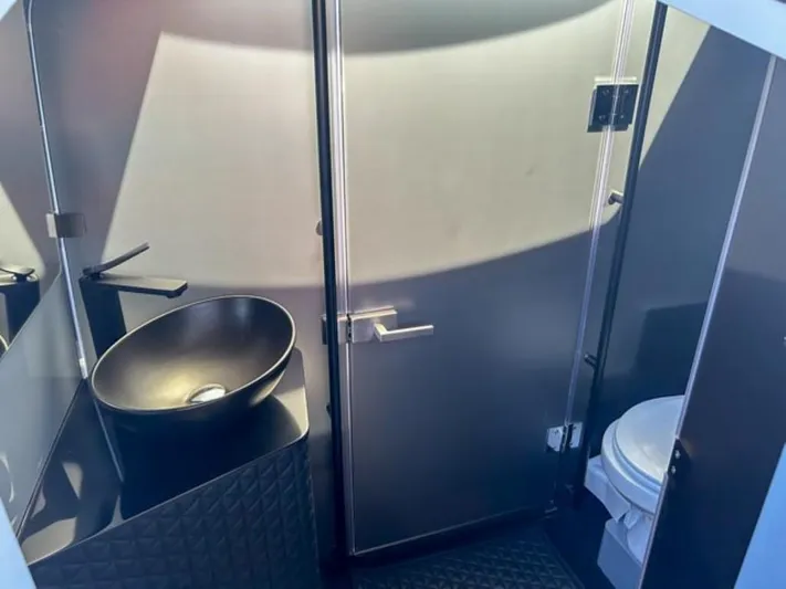  Yacht Photos Pics Luxurious bathroom interior of 2024 BRABUS Shadow 1000XC with modern sink and toilet.