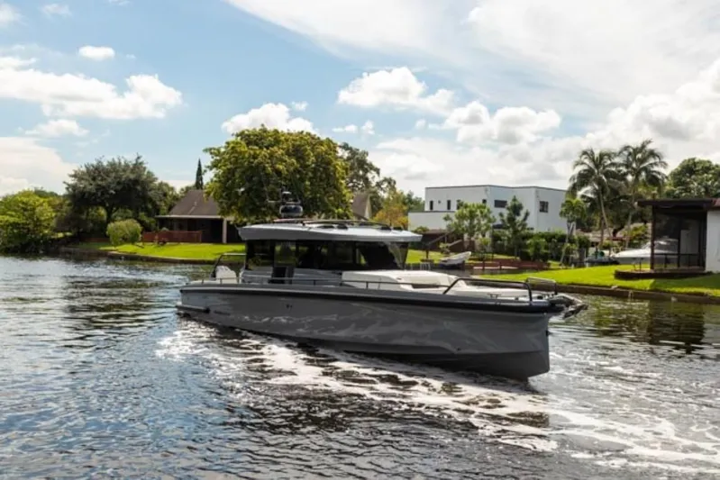  Yacht Photos Pics 2024 BRABUS Shadow 1000XC luxury boat cruising on a serene river.