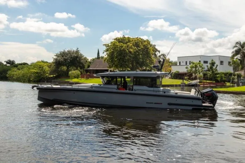  Yacht Photos Pics 2024 BRABUS Shadow 1000XC luxury boat cruising on a scenic river.