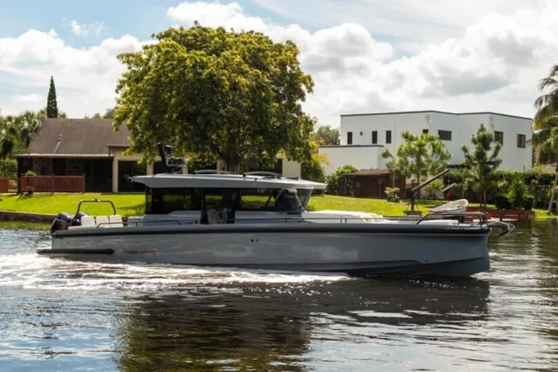  Yacht Photos Pics 2024 BRABUS Shadow 1000XC luxury yacht cruising on a scenic waterway.