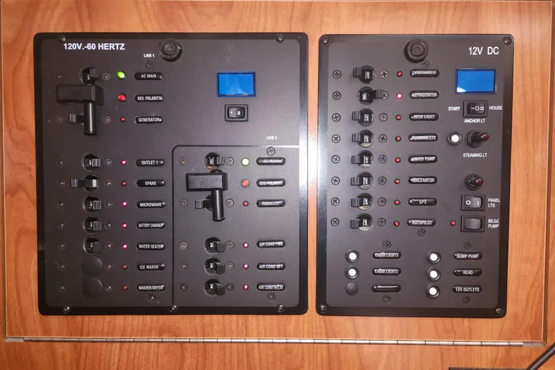 Antares Yacht Photos Pics Electrical control panel of a 2011 Hunter 39 boat, featuring 120V and 12V systems.