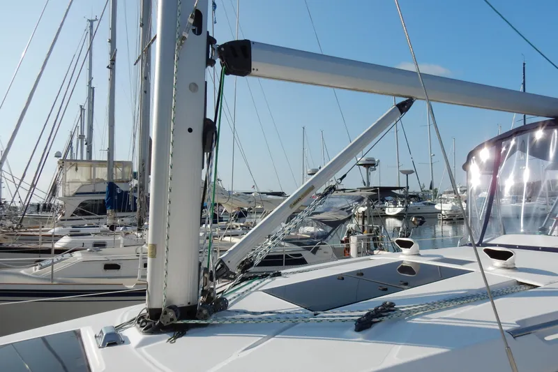 Antares Yacht Photos Pics 2011 Hunter 39 sailboat docked in marina, surrounded by other boats.