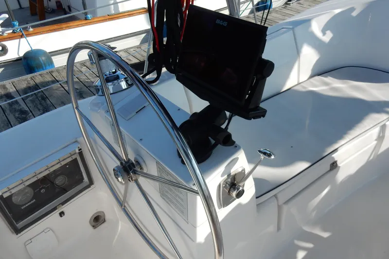 Antares Yacht Photos Pics Steering wheel and navigation system on a 2011 Hunter 39 sailboat.