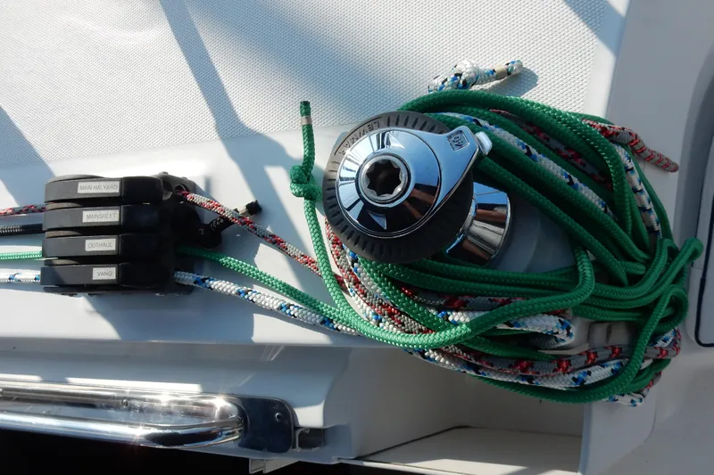 Antares Yacht Photos Pics Sailing equipment on a 2011 Hunter 39 yacht, featuring ropes and winch.
