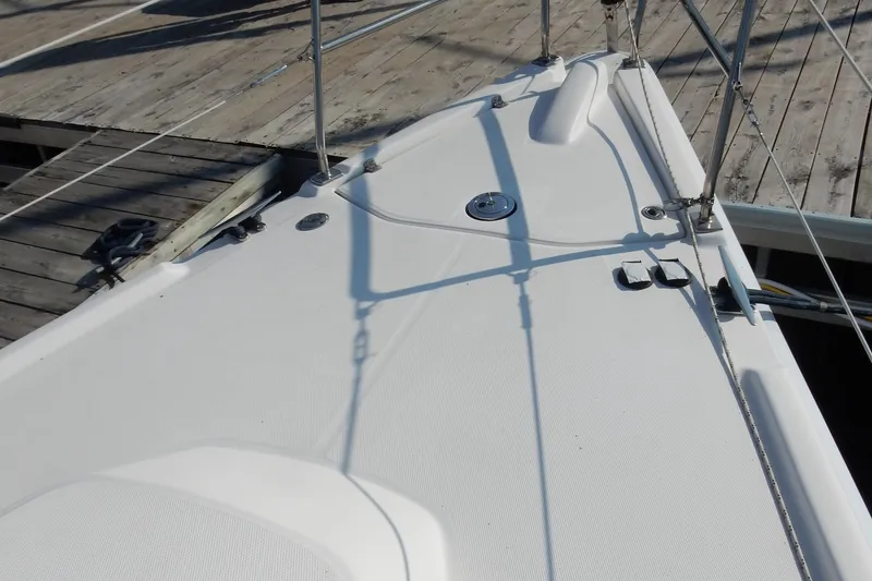 Antares Yacht Photos Pics Deck of 2011 Hunter 39 sailboat docked at a wooden pier.