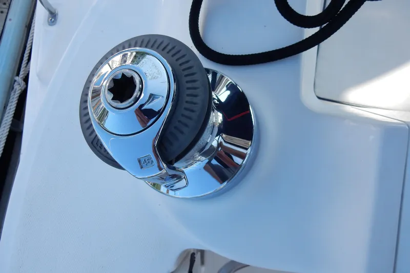 Antares Yacht Photos Pics Chrome winch on 2011 Hunter 39 sailboat deck, featuring a black rope.