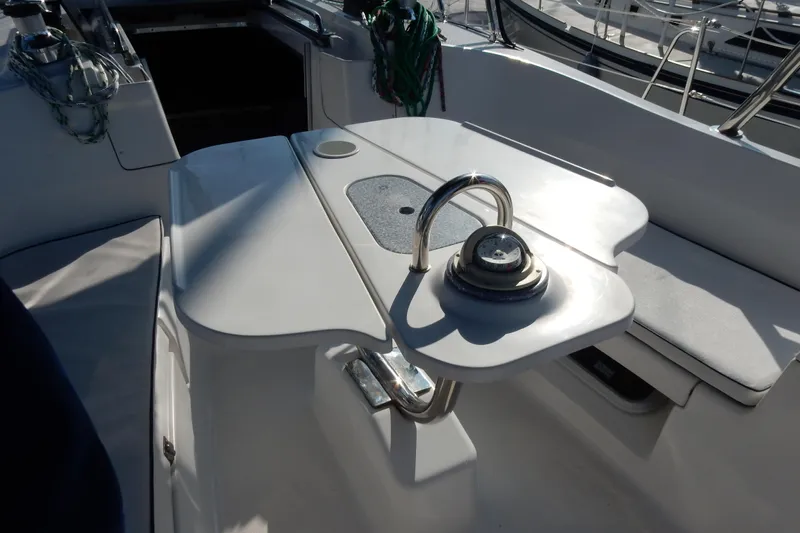 Antares Yacht Photos Pics Cockpit of 2011 Hunter 39 sailboat with steering wheel and seating area.