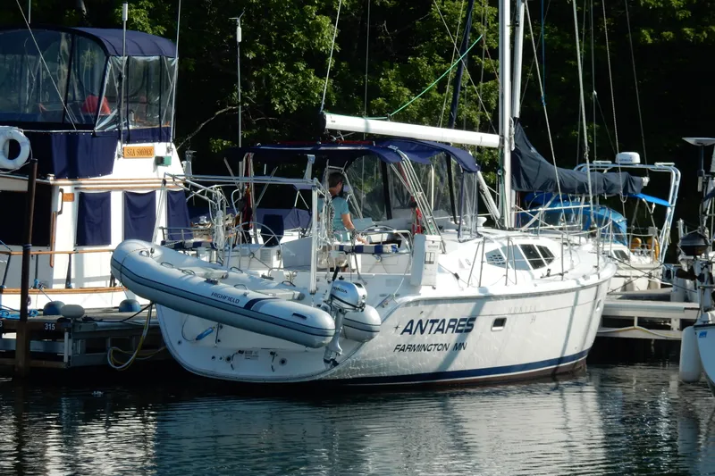 Antares Yacht Photos Pics Sailboat "Antares" docked, Hunter 39 model, 2011, with inflatable dinghy attached.