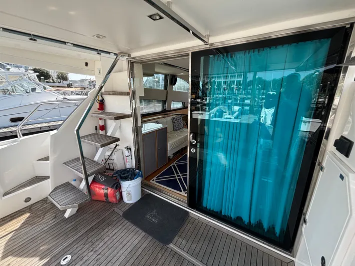 Sawbones Yacht Photos Pics 2015 Fairline Squadron 42 yacht interior with stairs and blue curtain.