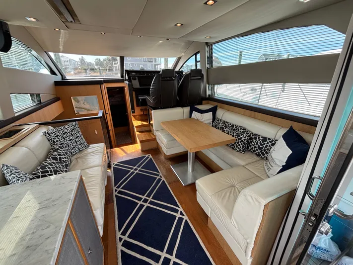 Sawbones Yacht Photos Pics Luxurious interior of 2015 Fairline Squadron 42 yacht with elegant seating and modern design.