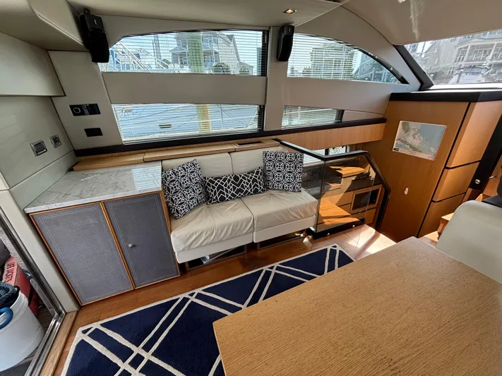 Sawbones Yacht Photos Pics Interior of 2015 Fairline Squadron 42 yacht, featuring modern seating and elegant design.