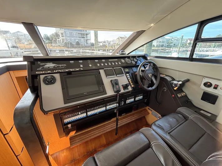 Sawbones Yacht Photos Pics 2015 Fairline Squadron 42 yacht helm with modern controls and leather seating.
