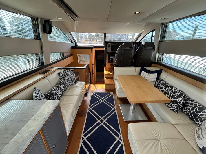 Sawbones Yacht Photos Pics Luxurious interior of 2015 Fairline Squadron 42 yacht with elegant seating and modern design.