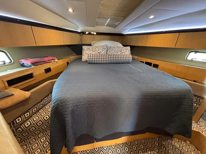 Sawbones Yacht Photos Pics Luxurious cabin interior of 2015 Fairline Squadron 42 yacht with cozy bedding.