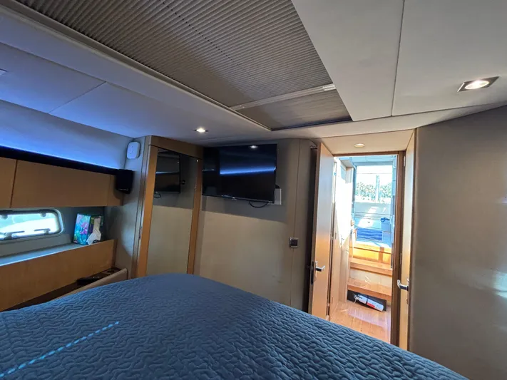 Sawbones Yacht Photos Pics Interior of 2015 Fairline Squadron 42 yacht bedroom with modern design and natural lighting.
