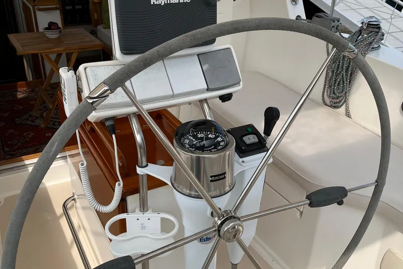 Spirit Yacht Photos Pics Steering wheel and navigation equipment on a 2001 Cabo Rico Northeast 400 sailboat.