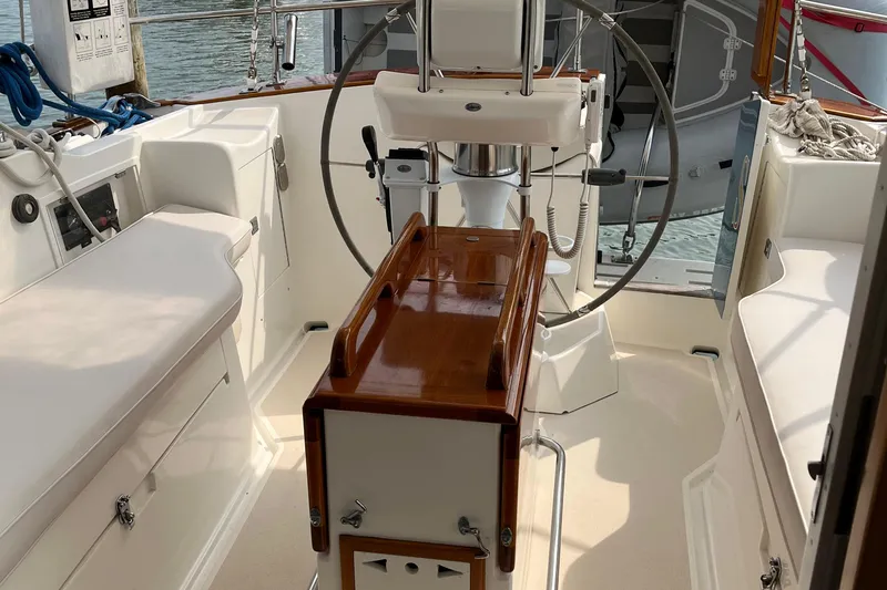 Spirit Yacht Photos Pics Interior view of 2001 Cabo Rico Northeast 400 sailboat cockpit with steering wheel.