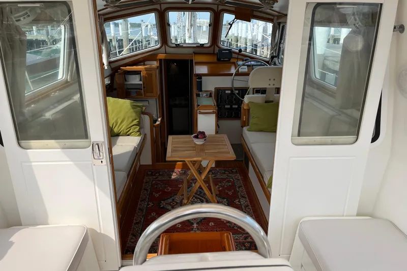 Spirit Yacht Photos Pics Interior of 2001 Cabo Rico Northeast 400 yacht with cozy seating and wooden accents.