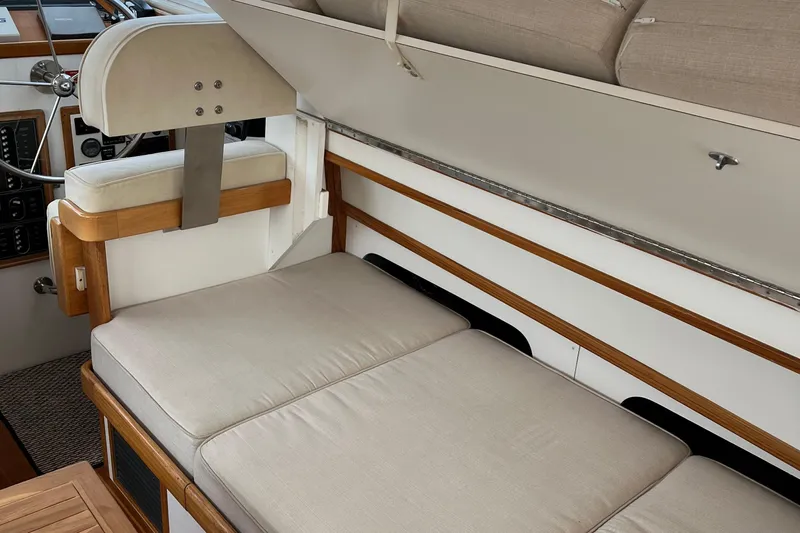 Spirit Yacht Photos Pics Interior of 2001 Cabo Rico Northeast 400 yacht with cushioned seating and wooden accents.