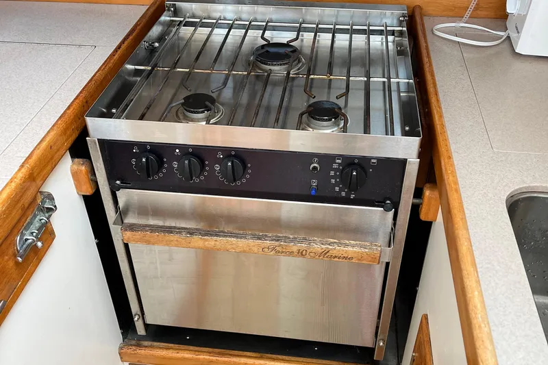 Spirit Yacht Photos Pics Stainless steel marine stove in 2001 Cabo Rico Northeast 400 yacht kitchen.